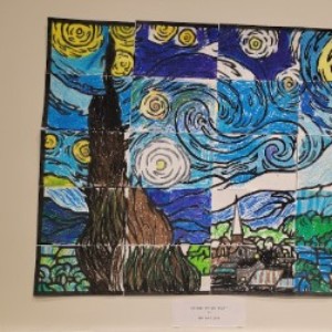 A drawn image by a 1st grader depicting a reproduction of the famous "Starry Night" painting.